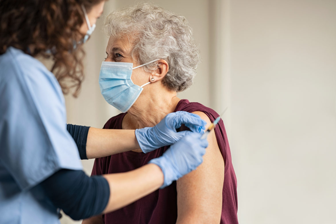 A woman getting a vaccination.